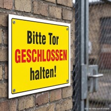 Das Bild zeigt ein gelbes Schild mit der Aufschrift...